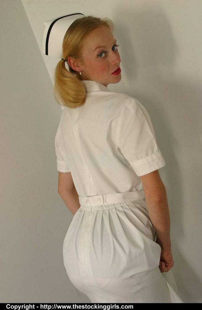 Amateur model frees her firm tits and twat from vintage nursing attire  
